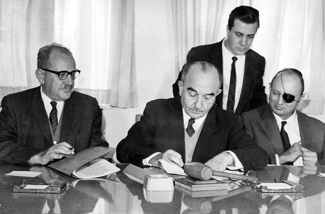 Prime Minister Eshkol signing the Covenant. KKL-JNF Photo Archive