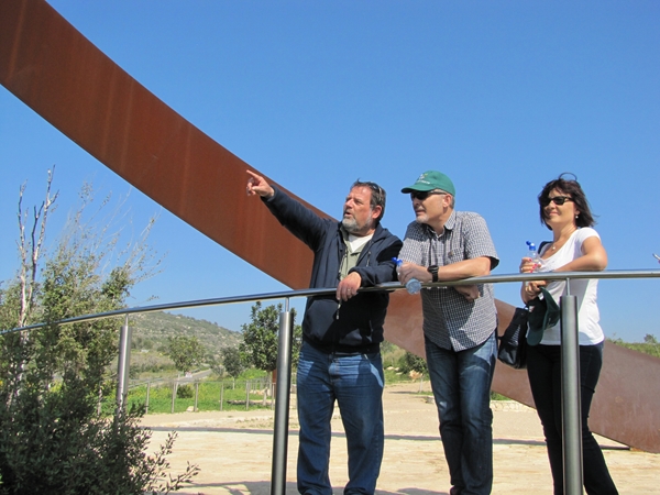 Michael Weinberger points out the site of the Carmel fire tragedy where a busload of 44 prison officers lost their lives. Photo by KKL-JNF