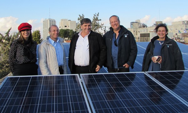 The newly installed solar panels on the roof of the KKL-JNF offices in Jerusalem, with Yardena Tubol, Director of KKL-JNF's Human Resources Division; Meir Speigler, KKL-JNF General Director; Danny Atar, KKL-JNF World Chairman; and Gil Panner, Director of Economic Development. Photo: Tania Susskind 