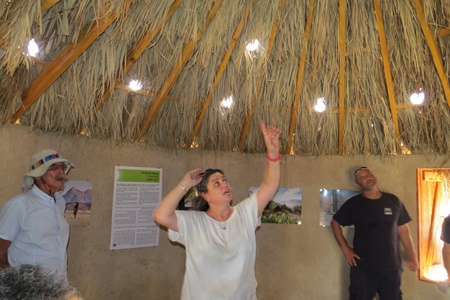 Holes in the ceiling provide natural natural light in a hut in the Ketura model off-grid village. Photo by Yoav Devir