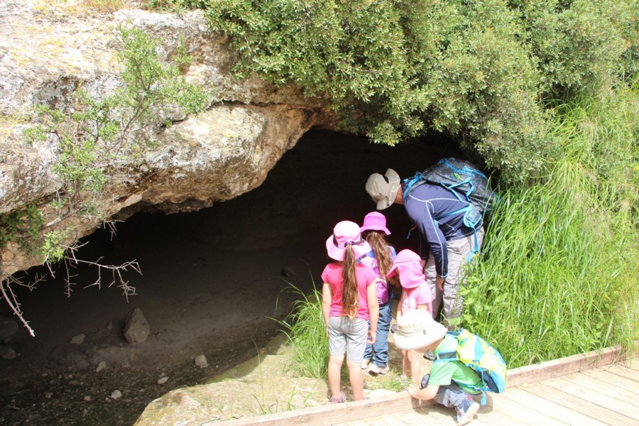 Exploring a cave along the Shimshit Trail. Photo: Yoav Devir, KKL-JNF